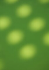 Obraz premium Soft, diffused light casts hazy, pale yellow-green circles across a vibrant green background.