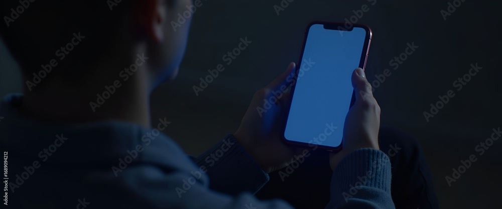 Poster close up of smartphone with blue light filter enabled in low light, demonstrating nighttime screen p