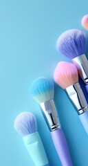 Pastel makeup brushes arranged diagonally against a light-blue background