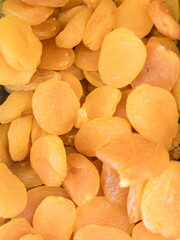 Golden dried apricots in bulk. Natural fruit snack and food background.