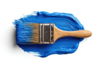A paintbrush dipped in vibrant blue paint, resting on a swathe of the same color