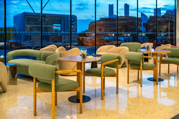 Modern lounge area with comfortable seating and city view