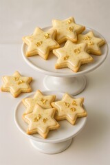 Homemade golden star Christmas cookies with powdered sugar dusting in ceramic bowl