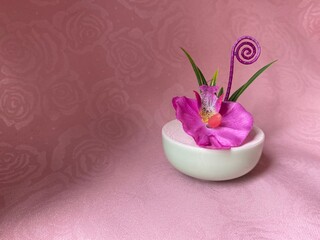 Fuchsia Faux Flower on a Pink Rose Background