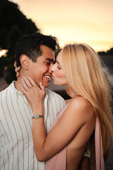 Passionate couple shares a romantic moment at sunset