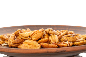 Peeled pecan nuts isolated on white background, close-up.