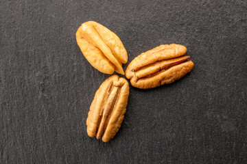 Shelled pecan nuts, top view, macro.