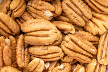 Shelled pecan nuts, top view, macro.