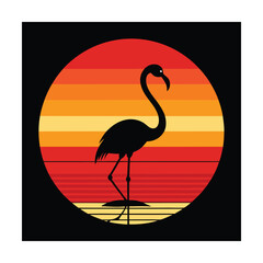 Silhouette of a flamingo standing in water against a sunset