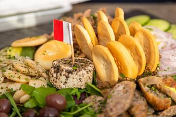 Traditional Maltese food platter with cheese and snacks in Birgu, Malta.