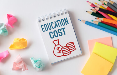Education Cost text written in Notebook. Business concept