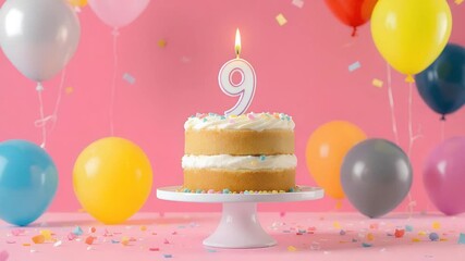 Birthday cake with a number nine candle and colorful balloons.