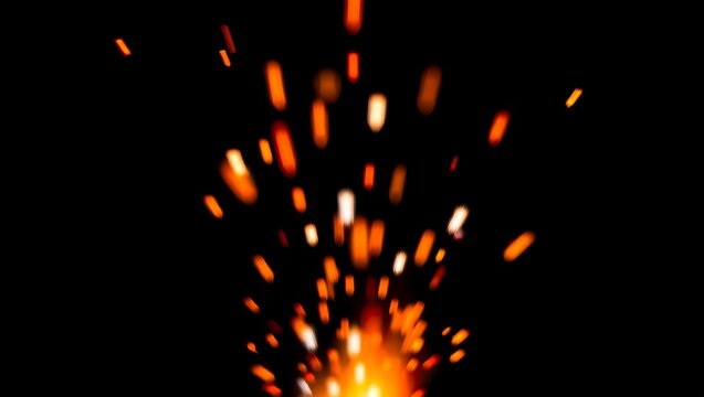 Orange and White Sparks Exploding on Black Background