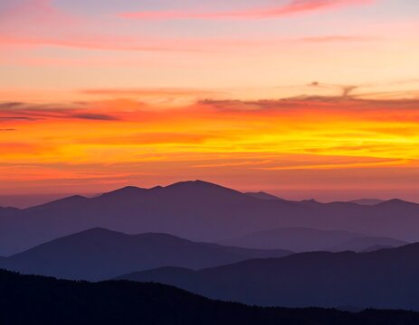 Mountain silhouettes at colorful sunset - Powered by Adobe