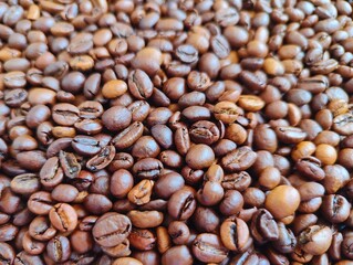 Close up photo image full frame of roasted aromatic coffee beans texture beautiful light vigor tranquil high quality resolution background backdrop wallpaper perfect for campaigns
