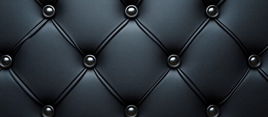 Obraz premium Luxurious Black Leather Upholstery with Diamond Pattern and Silver Buttons