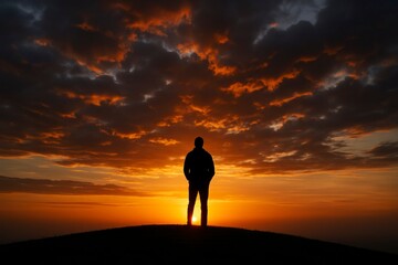 Obraz premium Silhouette of Person Watching Sunset on Hill