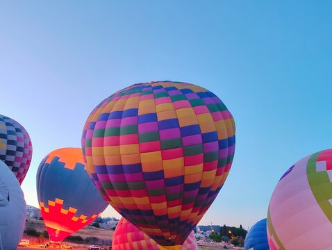 Beautiful colorful hot air balloons photo image ready to fly in blue clear sky over amazing valleys in Pamukkale Turkey high resolution hd wallpaper perfect for campaigns