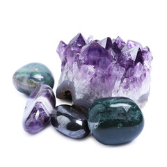 Many different healing stones isolated on white
