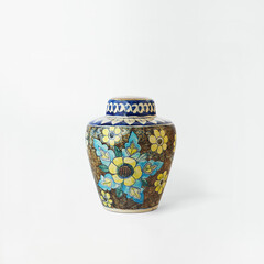 Ornate ceramic ginger jar with vibrant floral pattern and decorative lid