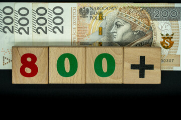 800 Plus - four PLN banknotes, each worth 200 PLN. Symbolic of the social program for parents in Poland. The "800 Plus" inscription is made from blocks used by children to play with