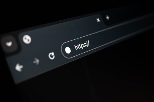 Close-up of a dark browser address bar with highlighted HTTPS protocol, symbolizing internet security, website encryption, and safe browsing. Ideal for cybersecurity and web development themes.