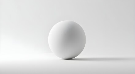 Minimalist still life of a single white sphere casting a soft shadow on a seamless white surface, representing purity, simplicity, and balance
