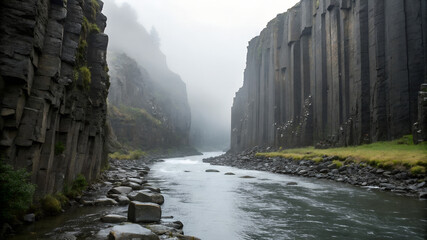 Misty basalt river gorge — jagged dark basalt walls, shallow river, low mist.
