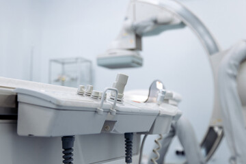 Medical angiograph machine with control panel and advanced imaging technology in a clinical...