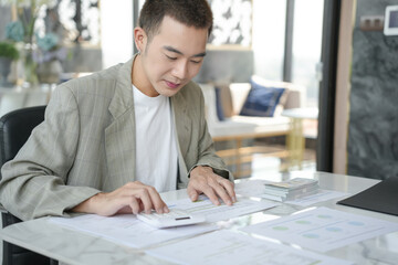 Confident asian business man Auditor or internal revenue service staff checking annual financial...