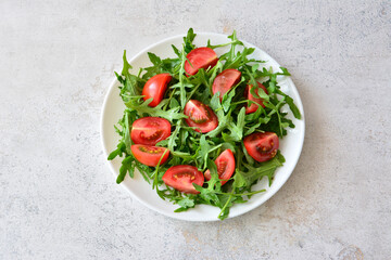 Fresh Salad with Arugula and Tomatoes top view