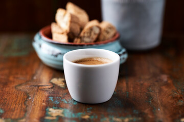 Cup of coffee on rustic wooden background. Soft focus. Copy space	
