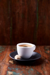 Cup of coffee on rustic wooden background. Soft focus. Copy space	