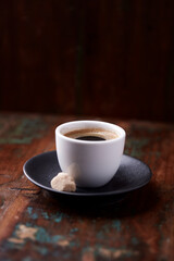 Cup of coffee on rustic wooden background. Soft focus. Copy space	