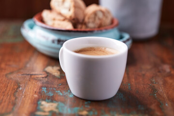 Cup of coffee on rustic wooden background. Soft focus. Copy space	