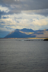 Dramatic Mountain Landscape with Clouds over the Sea in Iceland
