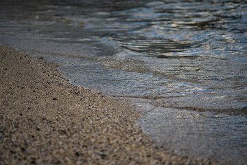 Gentle Ocean Waves Touching Sandy Shoreline in Iceland
