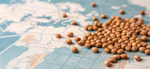Fototapeta premium Soybean seed scattered on world map highlight global food supply challenges and agricultural trade issues for sustainable development