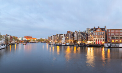Canal in the Old Town of Amsterdam in the evening time.