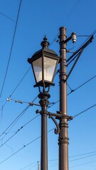 Vintage street lamp against a clear blue sky