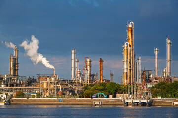 equipment of gas oil refining plant in Japan industrial factory area with blue sky background view from Fishing port, Yokkaichi, Mie Prefecture, Japan.