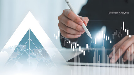 Analytics Vision: A focused professional engages with the interface, utilizing technology to analyze and interpret complex data sets.