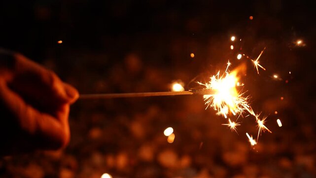 [Super Slow Motion] Happy children playing with sparklers in the garden on a summer evening