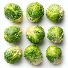 Fototapeta premium Nine fresh Brussels sprouts arranged in a neat grid, showcasing their vibrant green color and intricate texture. Perfect for culinary and healthy eating concepts