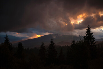 Fototapeta premium Dramatic Sunset Over Mountain Landscape