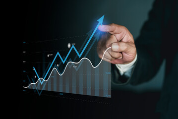 Businessman pointing growing up graph on virtual hologram display. Corporate future growth plan,...