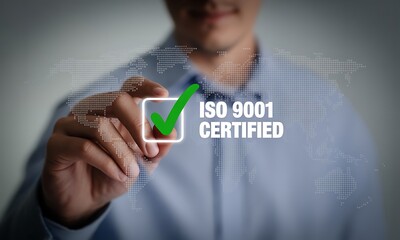 ISO 9001 Certified Concept. Businessman Marking Green Check on Transparent Screen Representing Quality Assurance, Management System, and International Standard Certification.