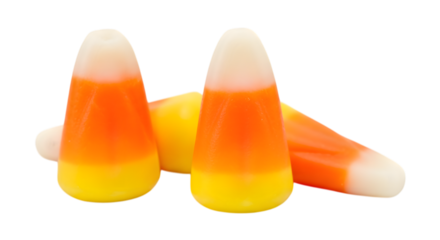 Three pieces of candy corn, a classic halloween candy, isolated on transparent background