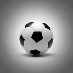 Naklejka premium Classic soccer ball with black and white panels rests on a neutral gradient background in studio photography