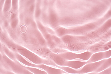 Abstract pink water background with streaks of water.
